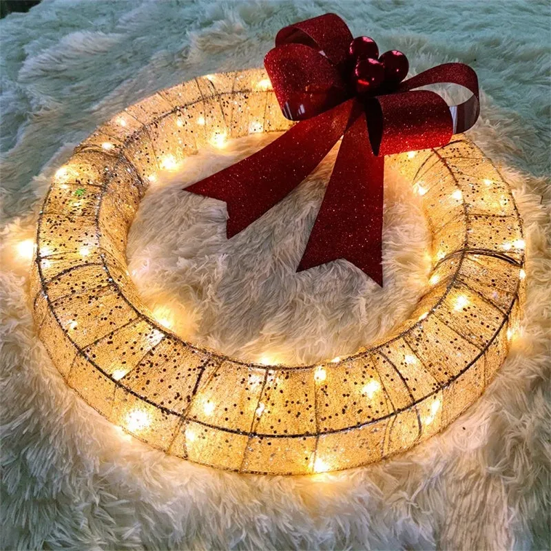 50cm gold and green Christmas garland with LED lights and bowknot on a door
