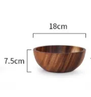 Handmade brown wooden bowl set showing multiple sizes from small to large on wooden table