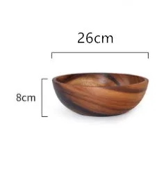 Handmade brown wooden bowl set showing multiple sizes from small to large on wooden table