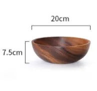 Handmade brown wooden bowl set showing multiple sizes from small to large on wooden table