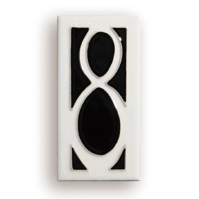 Handmade retro-style ceramic doorplate with an enamel art number on a white background.