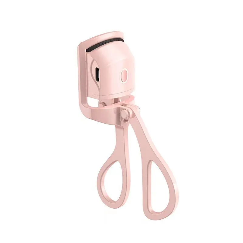 White and pink USB rechargeable heated eyelash curler with curved silicone pad.
