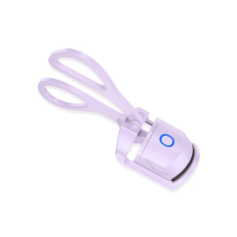 White and pink USB rechargeable heated eyelash curler with curved silicone pad.