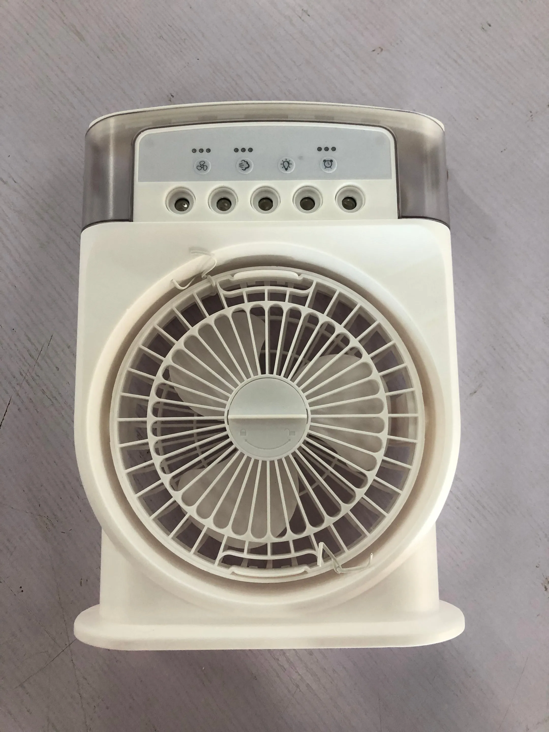 Portable USB air conditioner cooling fan with 5 spray mist outlet, 600ml water tank, 7 colour LED lights, and leather handle in white