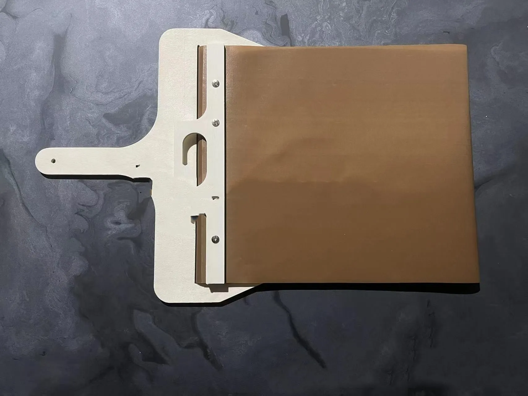 Natural wood sliding pizza peel in log colour with wooden handle, available in three sizes for transferring baked goods