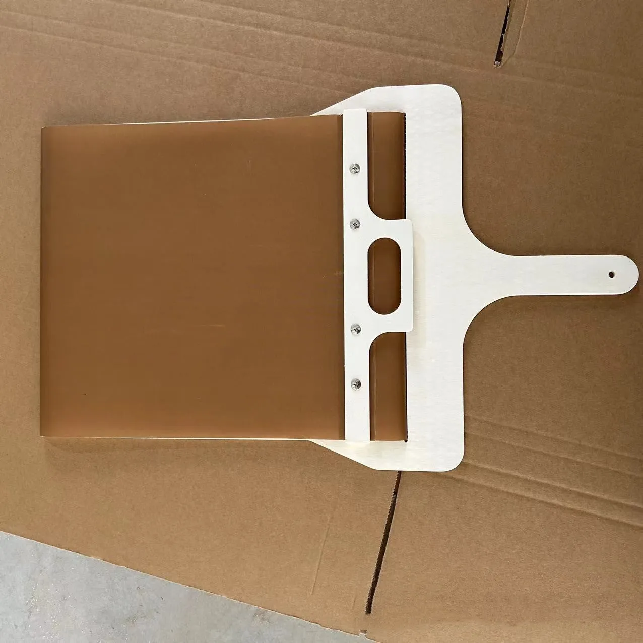 Natural wood sliding pizza peel in log colour with wooden handle, available in three sizes for transferring baked goods