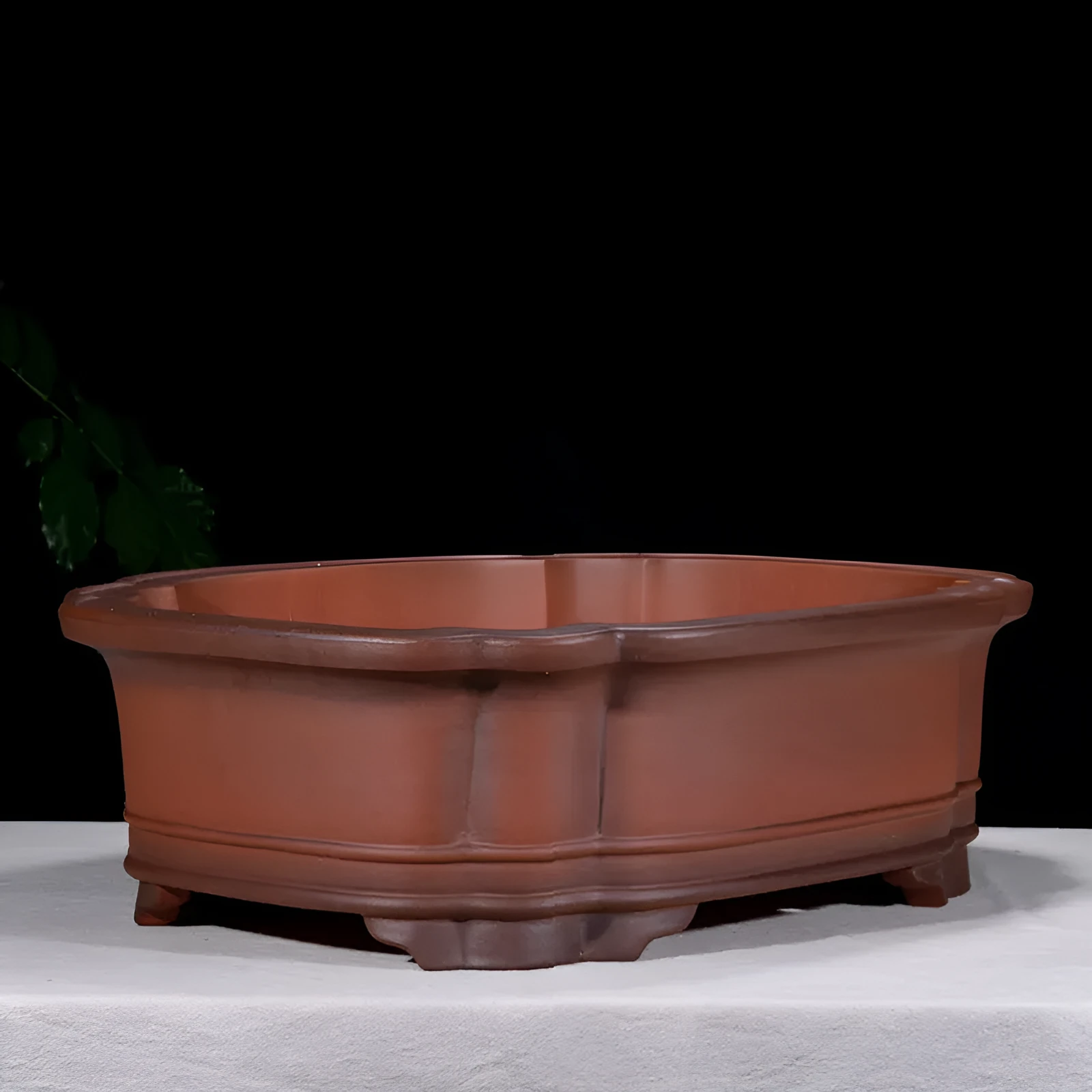 Large antique-style rectangular purple clay flowerpot for garden trees and plants.