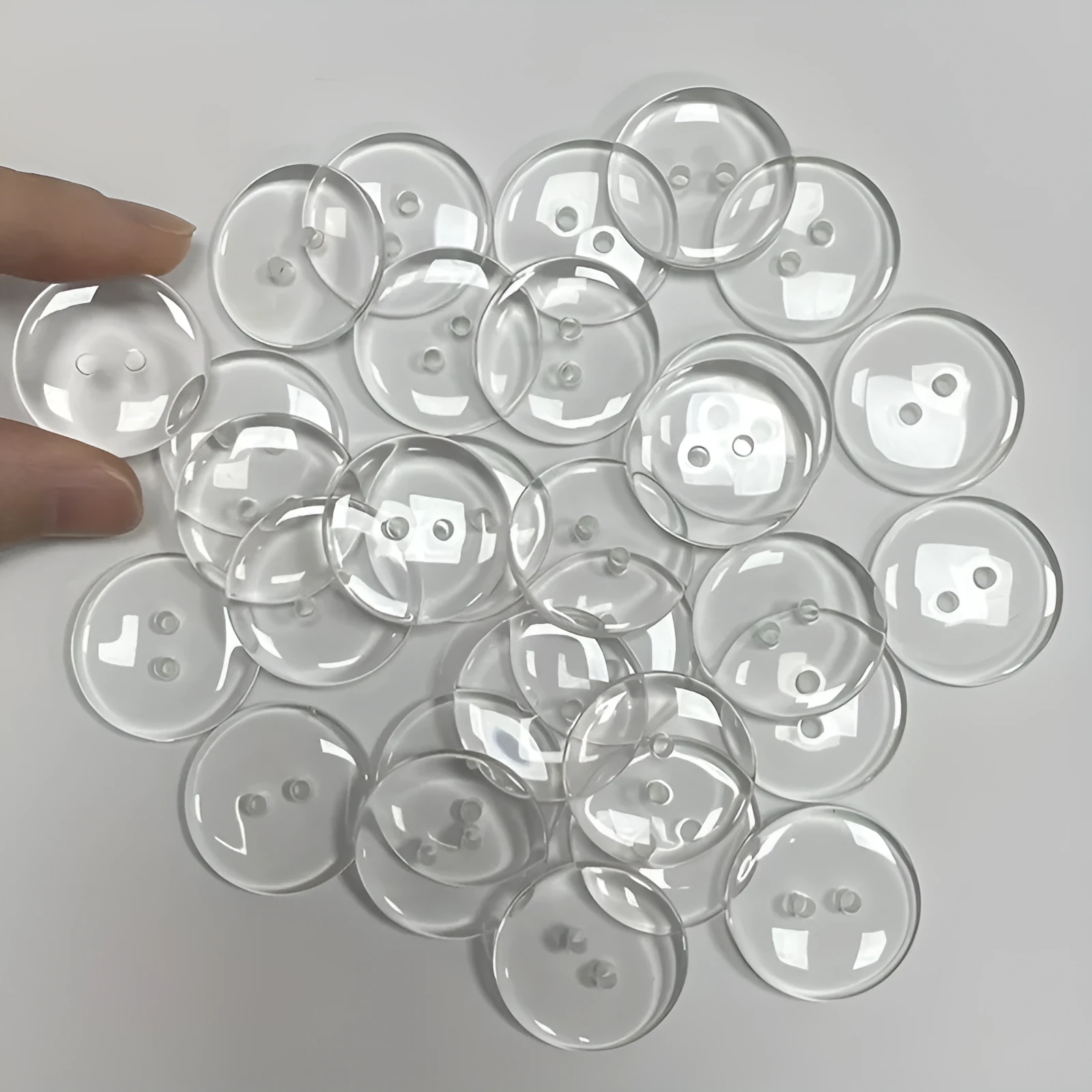 Transparent resin sewing buttons with two holes and 10mm diameter in a 100-piece pack