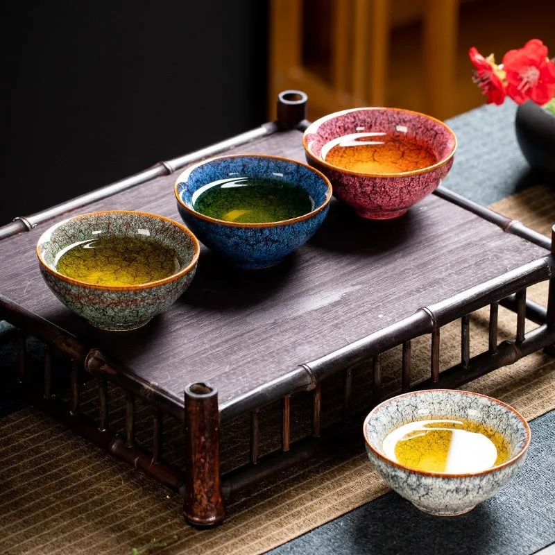 Ceramic Kung Fu tea cup set with four cups in a light-coloured new Chinese style gift box.