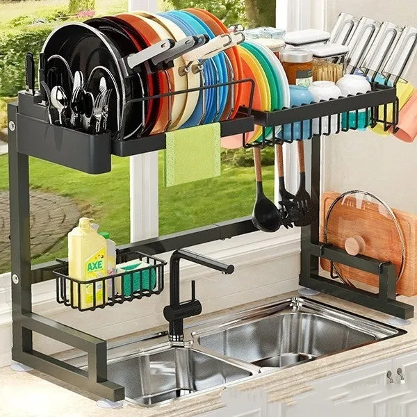 Black retractable metal kitchen draining rack with water pot holder on countertop