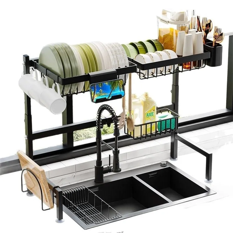 Black retractable metal kitchen draining rack with water pot holder on countertop