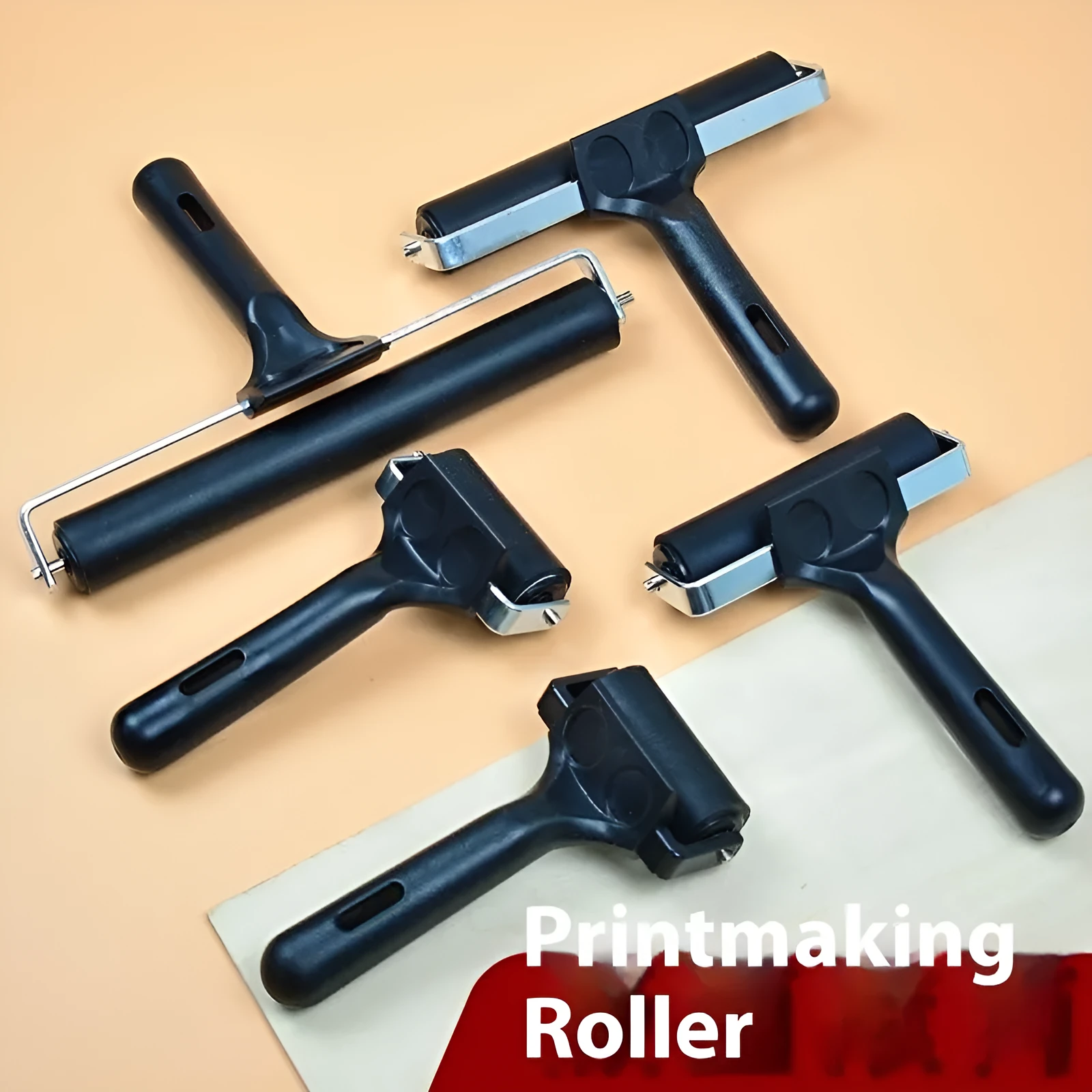 Black rubber paint roller tool with metal bracket, 6cm wide, for wall painting.