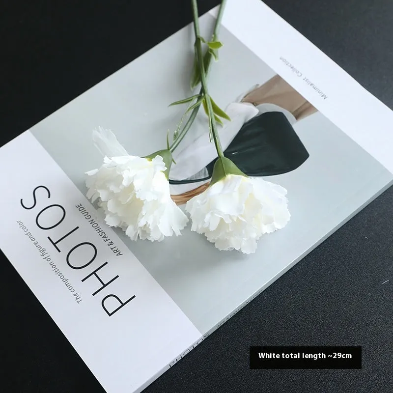 Artificial carnation flower with silk petals on soft rubber base in four colour options