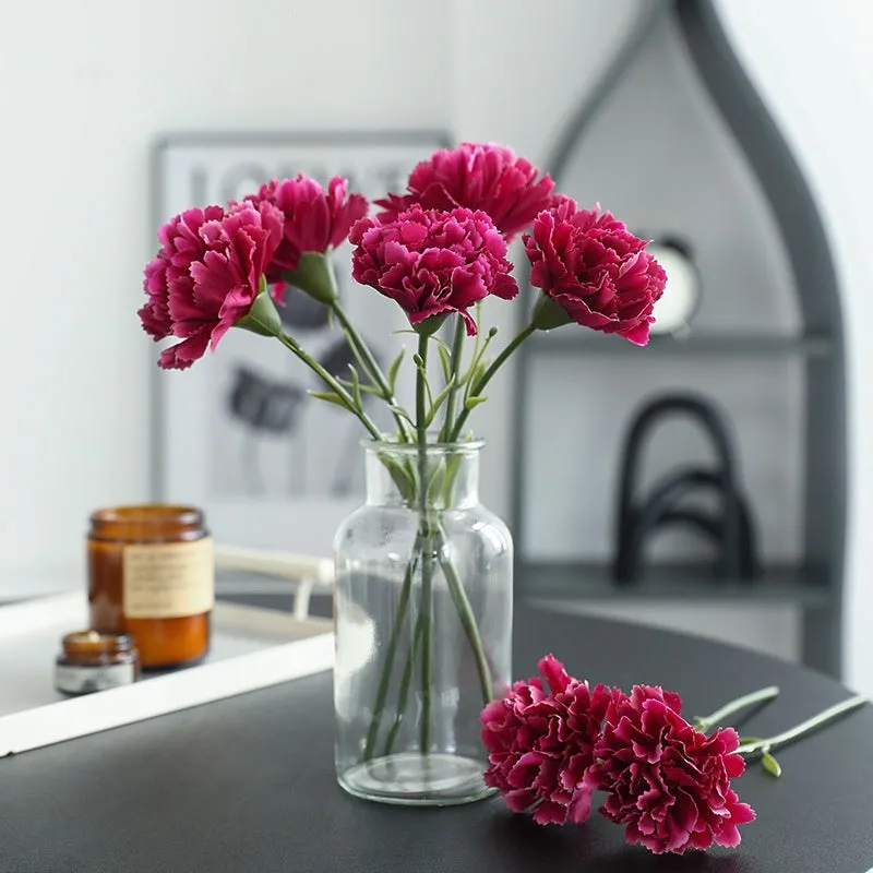 Artificial carnation flower with silk petals on soft rubber base in four colour options