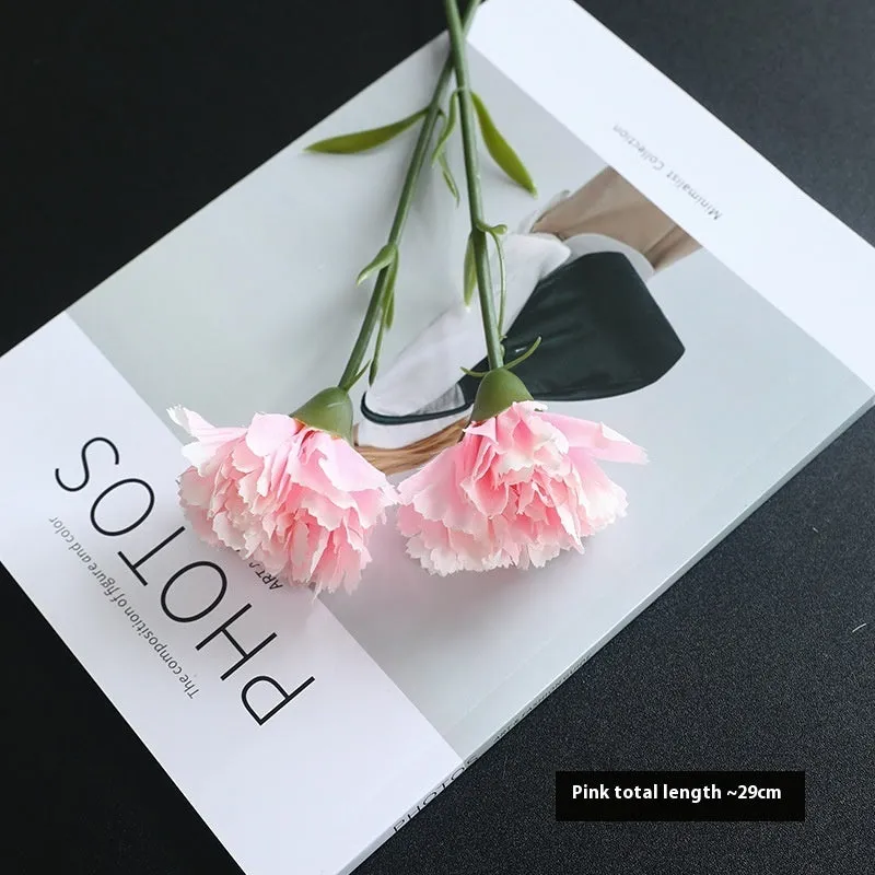 Artificial carnation flower with silk petals on soft rubber base in four colour options