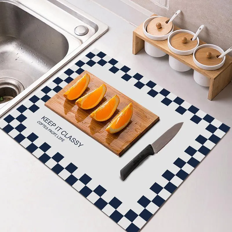 Square 60x90 cm rubber kitchen draining pad in blue checked pattern on countertop