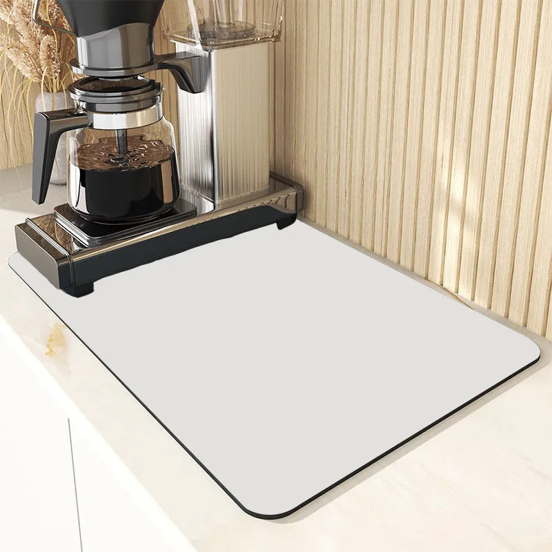Square 60x90 cm rubber kitchen draining pad in blue checked pattern on countertop