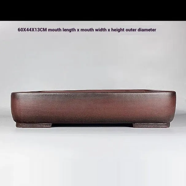 Handmade rectangular purple clay flower pot with antique finish showing internal planting space