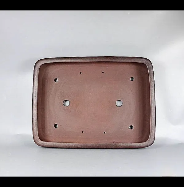 Handmade rectangular purple clay flower pot with antique finish showing internal planting space