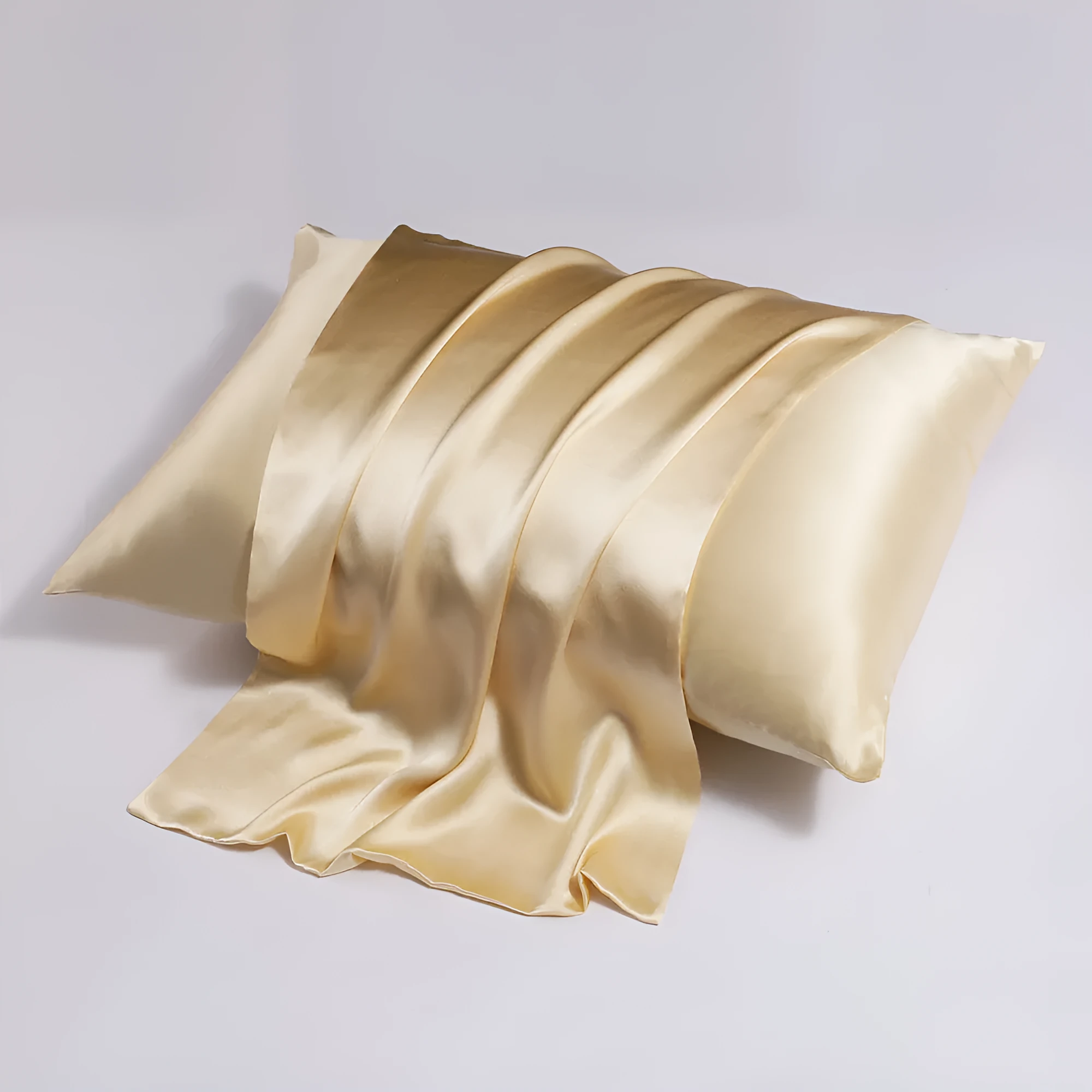 Close-up of a navy blue silk pillowcase showing a discreet zipper closure along the seam.