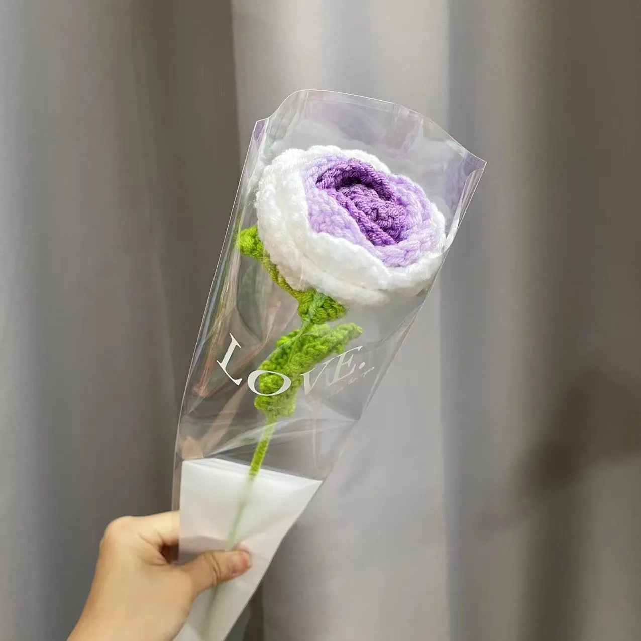 Artificial silk rose bouquet with blue gradient wool-weave petals on a single stem.