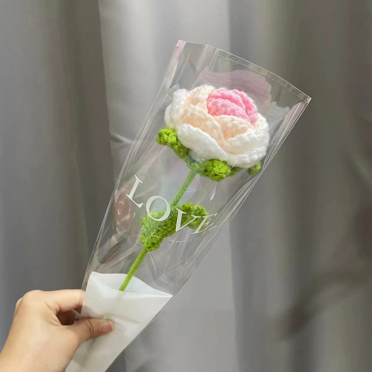 Artificial silk rose bouquet with blue gradient wool-weave petals on a single stem.