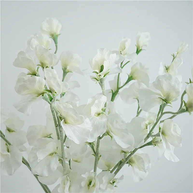 Silk artificial pea flower single stem in pink with green wire stem on white background