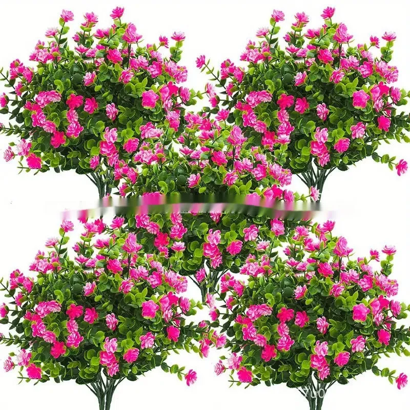 Artificial eucalyptus camellia plastic bouquet in mixed colours on white background