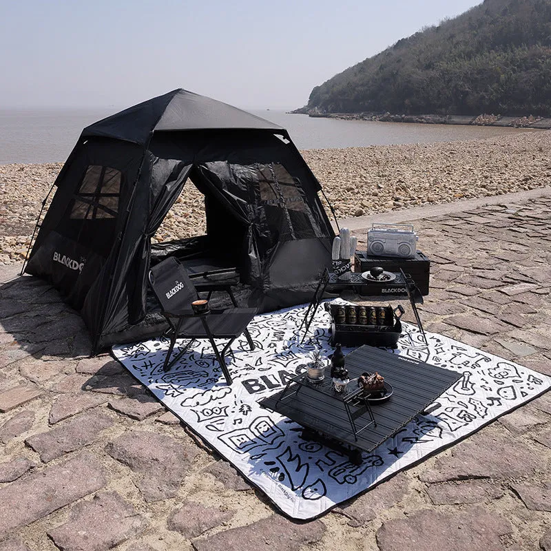 Thickened outdoor picnic mat in Night Black on grass, 200x200cm polyester fibre moisture-proof ground cover