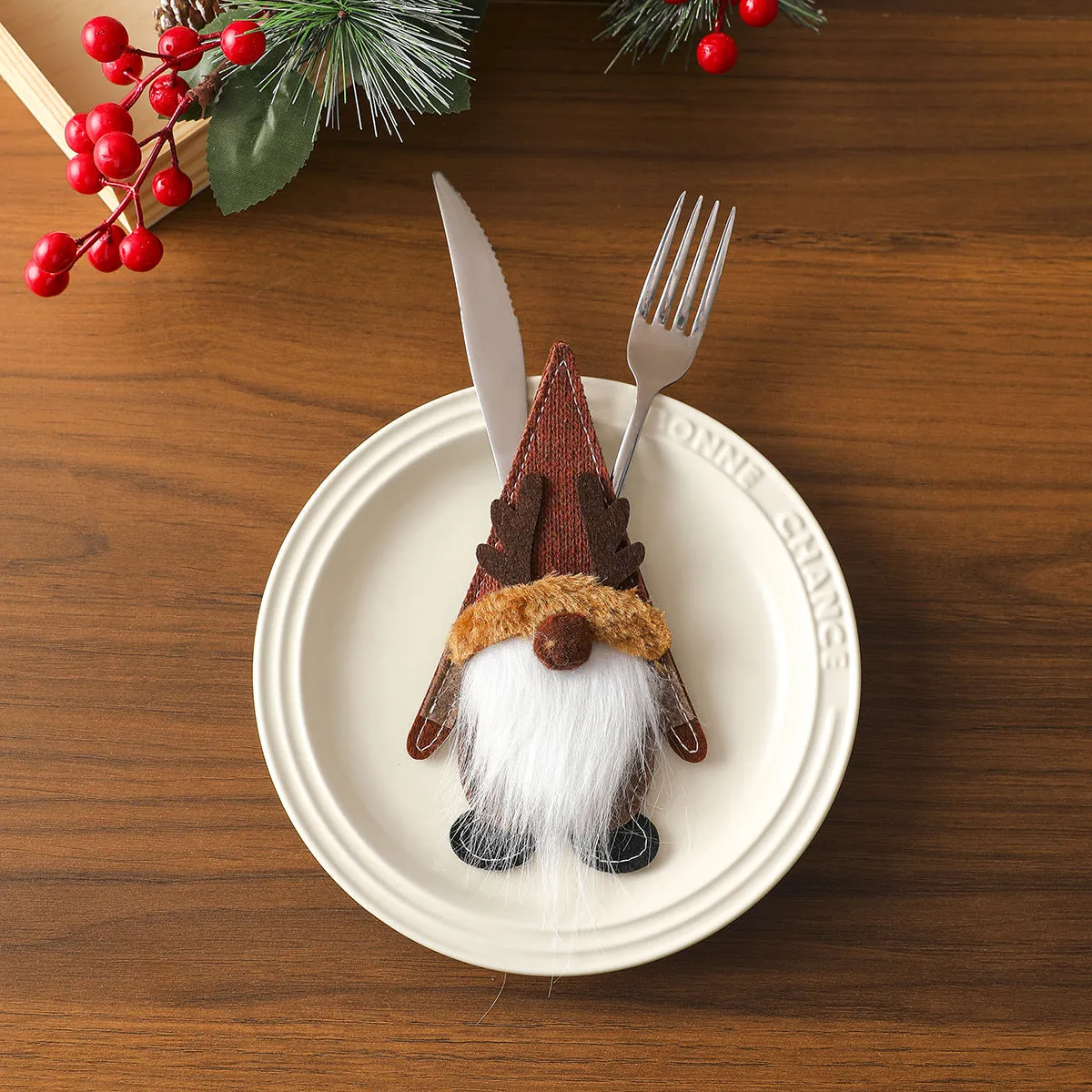 Christmas knife and fork cloth cover in snowflake style on a dining table