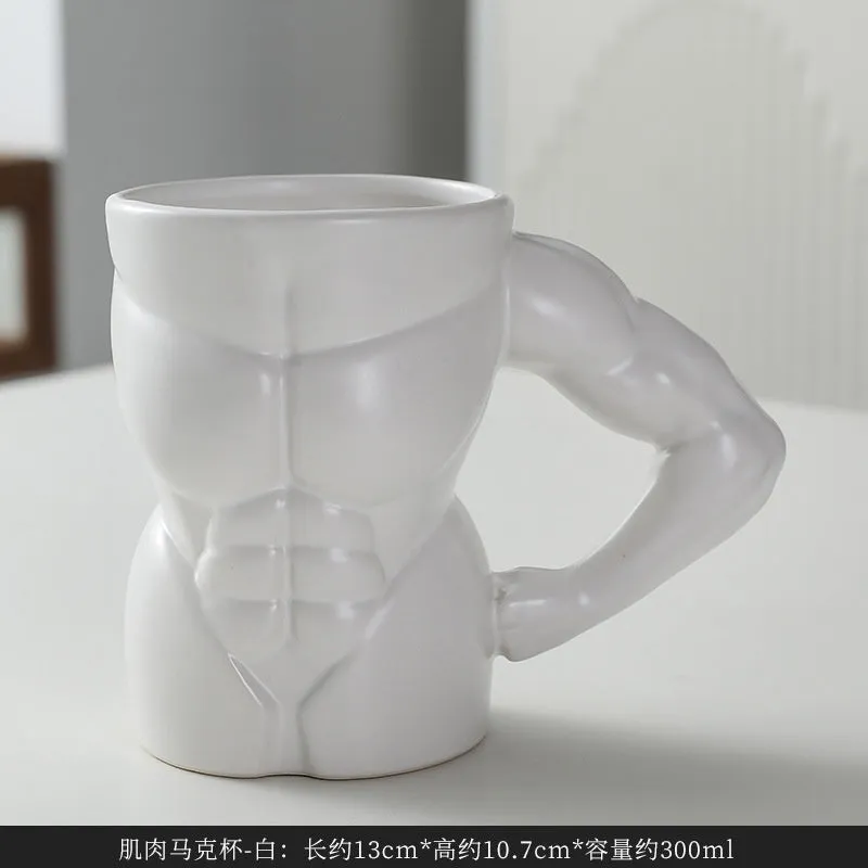 Matte black ceramic mug with muscle man design and 300ml capacity.