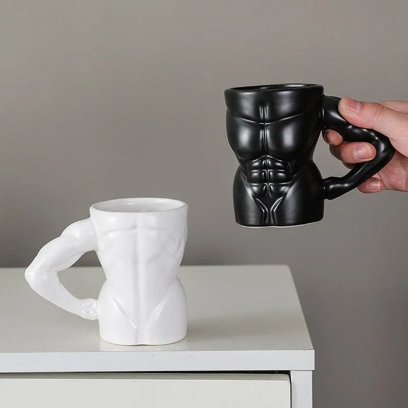 Matte black ceramic mug with muscle man design and 300ml capacity.
