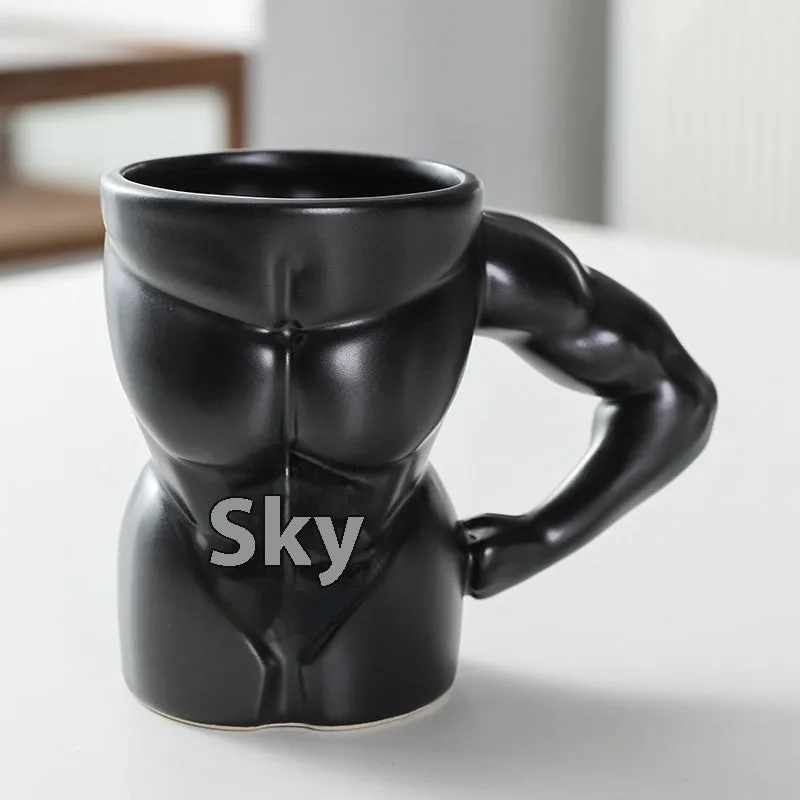Matte black ceramic mug with muscle man design and 300ml capacity.