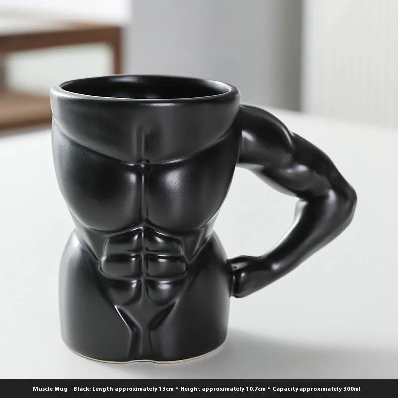 Matte black ceramic mug with muscle man design and 300ml capacity.