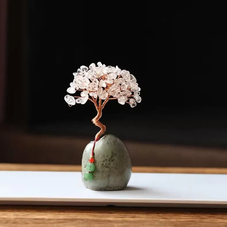 Natural citrine crystal Pachira Macrocarpa lucky ornament on a plain background.