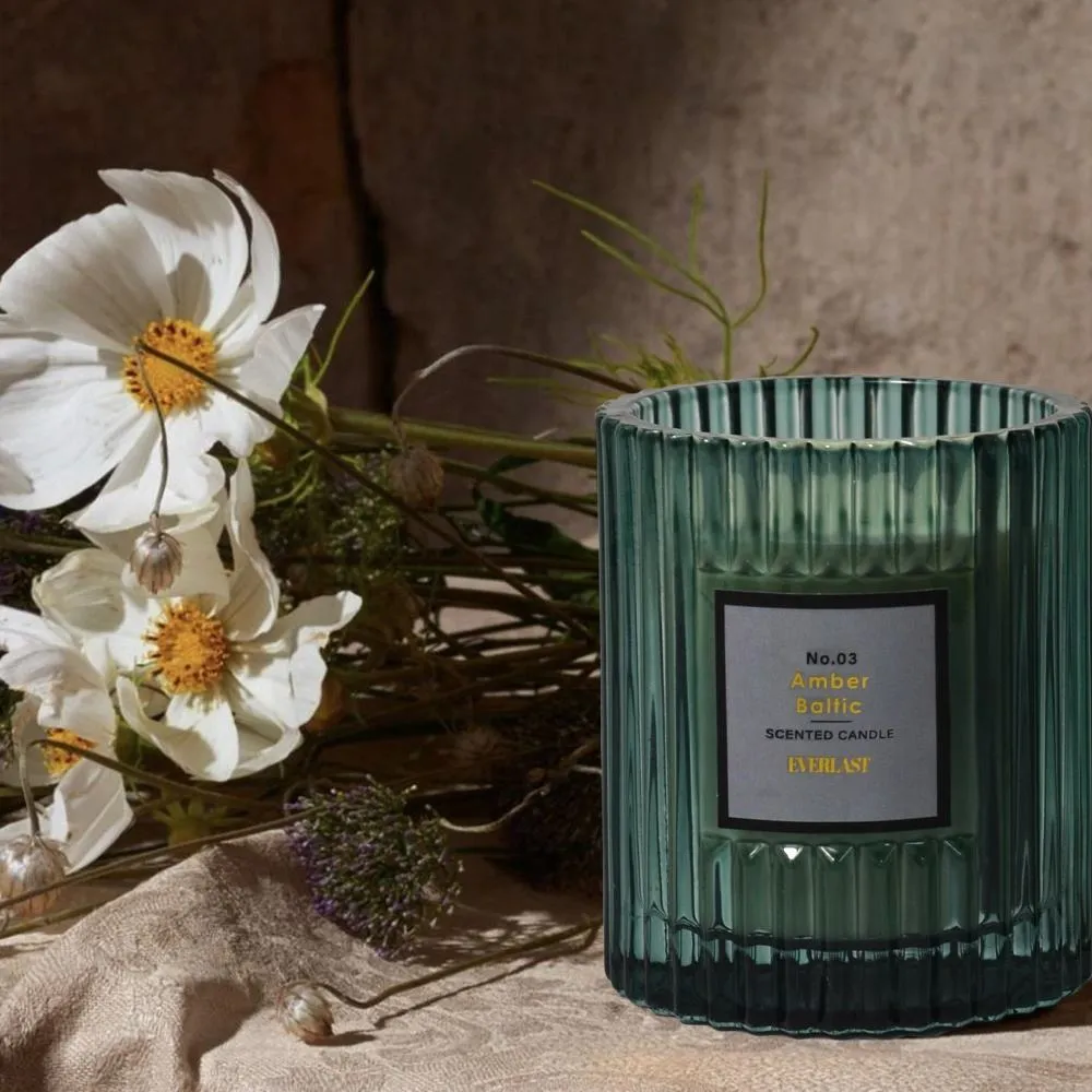 Cylindrical soy wax aromatherapy candle in amber colour with smooth surface