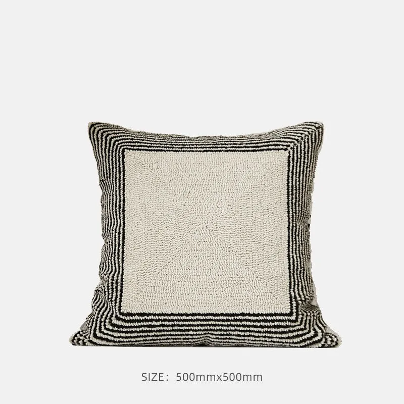 Black and white geometric patterned square and waist living room cushions with towel embroidery.