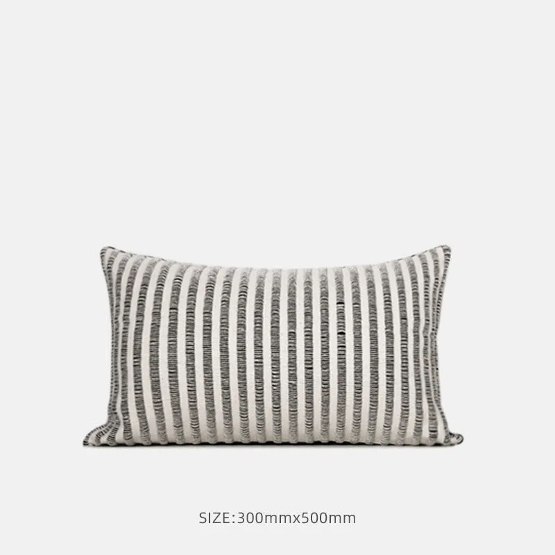 Black and white geometric patterned square and waist living room cushions with towel embroidery.
