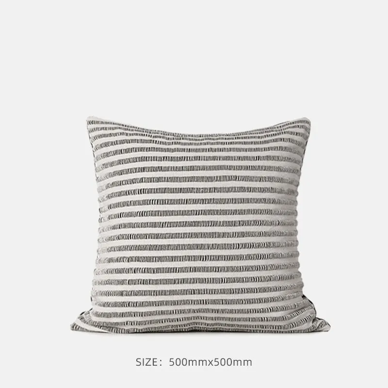 Black and white geometric patterned square and waist living room cushions with towel embroidery.