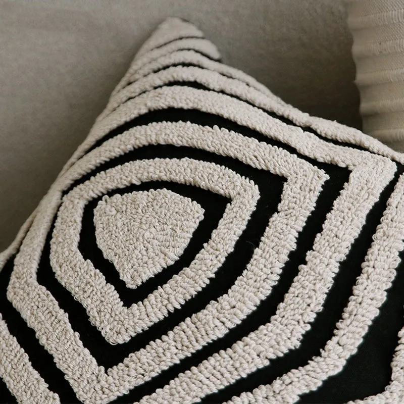 Black and white geometric patterned square and waist living room cushions with towel embroidery.