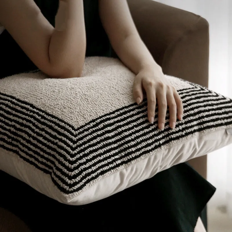 Black and white geometric patterned square and waist living room cushions with towel embroidery.