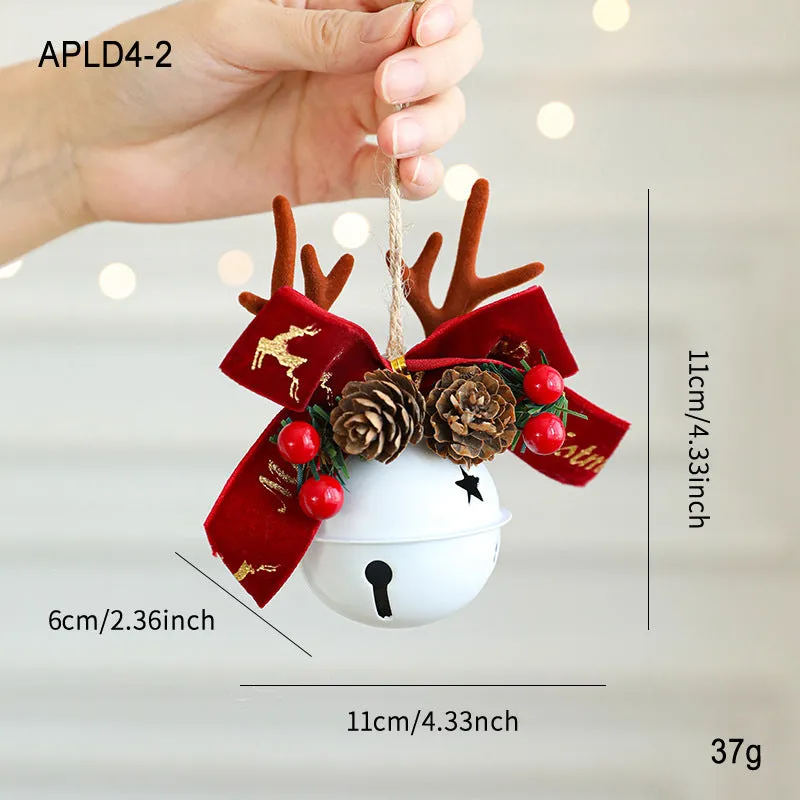 Wrought iron window hanging ornament with a jingling bell, antlers, and pine cone design in a choice of colours.