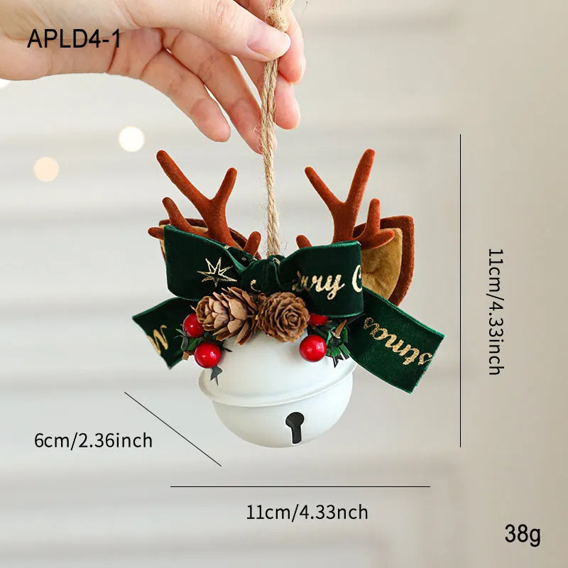 Wrought iron window hanging ornament with a jingling bell, antlers, and pine cone design in a choice of colours.
