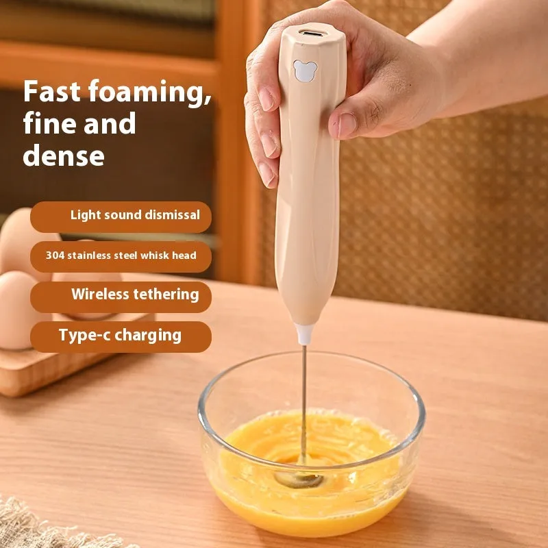Handheld personalised milk frother in beige, black, or white with stainless steel whisk and Type-C charging port.