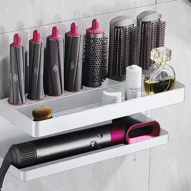 White double-layer punch-free aluminium rack holding hair curlers on a bathroom wall.