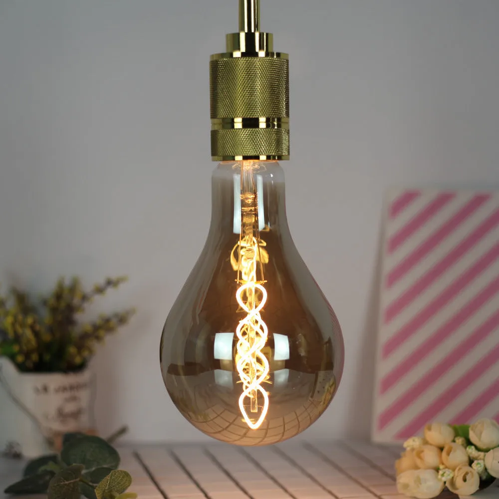 Close-up of a double helix LED filament light strip with golden spiral, showing 110mm by 200mm rectangular shape.