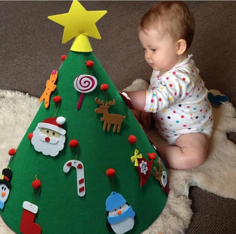 Felt Christmas tree three-dimensional DIY puzzle kit with cone base and felt balls on a surface