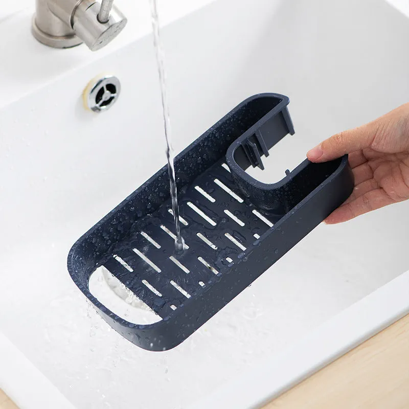 Blue sink shelf faucet holder with sponge and brush storage tray on a kitchen sink