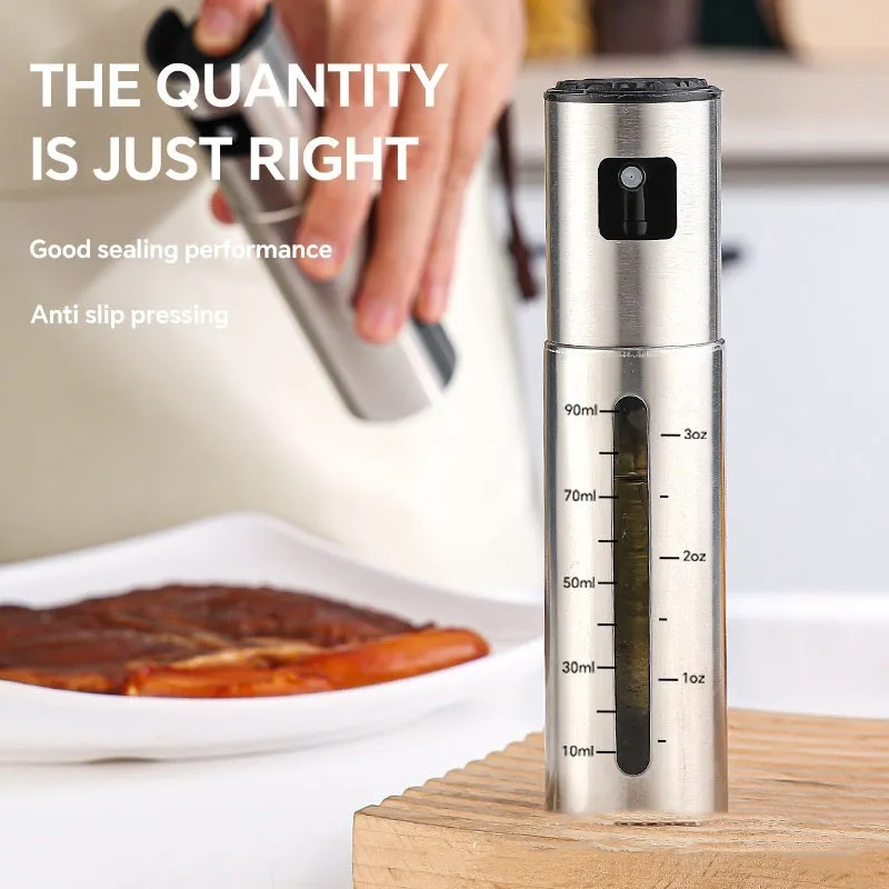 Press-type stainless steel oil spray bottle with 100ml capacity and glass body for kitchen use