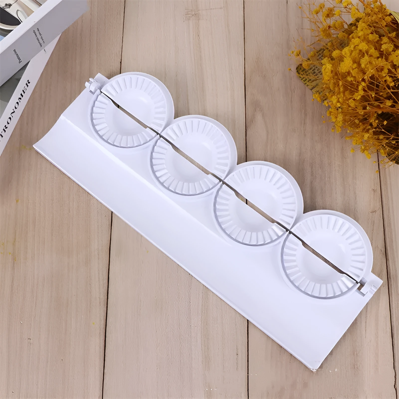 Pure white ABS plastic dumpling maker on a kitchen counter, compact design, modern simple style